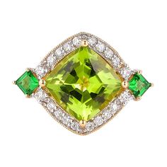 This collection features an array of pretty peridot rings! Accented with diamonds these rings are made in yellow gold and present a vibrant and fresh look. Classic peridot ring in 18K yellow gold with diamonds. Peridot: 4.75 carat cushion shape. Tsavorite: 0.406 carats square shape. Diamonds: 0.574 carat, G colour, VS clarity. Gold: 5.0938g, 18K yellow gold. Ring Size: US 6.75 - Size can be adjusted for free upon request - please reconfirm with your order. R644 Luxury Gold Tsavorite Rings, Luxury Peridot Three-stone Rings, Luxury Unique Peridot Rings, Luxury Green Diamond Ring With Gemstone Accents, Green Peridot Diamond Ring With Accent Stones, Yellow Gold Peridot Rings With Gemstone Accents, Peridot Rings, Peridot Ring, 18k Yellow Gold Ring