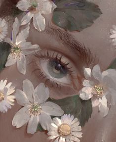 a woman's eye is surrounded by flowers and leaves on her face, as if it were painted in pastel colors