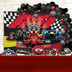 a birthday party with balloons and race cars