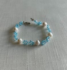 This item is handmade using fresh water white potato pearls and pink beads. Bead Flowers, Two Flowers, Pink Beads, Handmade Bracelet, Turquoise Beads, Beaded Flowers, Bracelet Gift, Gift Birthday, Pearl Bracelet