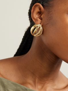 The Ysso's earrings have been hand-carved in Greece to resemble the natural form of a 'Flower Bud'. They're crafted from gold-plated bronze and have a distinctive curved shape with contoured beams. Wear yours to make a statement. Elegant Hand Cast Gold Earrings, Gold Polished Brass Earrings, Gold Brass Earrings With Polished Finish, Gold-tone Brass Earrings With Polished Finish, Polished Yellow Gold Brass Earrings, Yellow Gold Brass Plug Earrings, Elegant Hand Cast Drop Earrings, Elegant Hand Cast Brass Earrings, Elegant Gold Brass Wrap Earrings