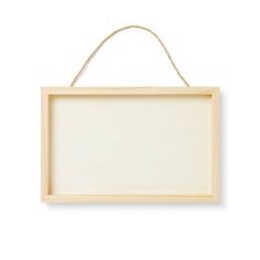 a wooden sign hanging on a rope against a white wall with an empty board attached to it