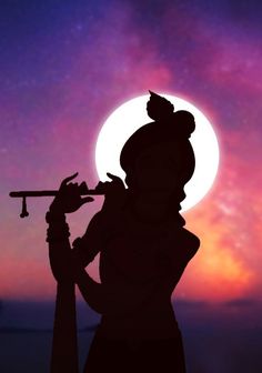 the silhouette of a person holding a telescope in front of a purple and blue sky