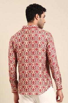 Peach shirt featuring Mughal floral print all over with cuff sleeves and front button placket. - Aza Fashions Diwali Cotton Long Sleeve Tops, Traditional Long Sleeve Tops With Ikat Print, Traditional Long Sleeve Ikat Print Top, Diwali Long Sleeve Tops With Printed Motifs, Festive Red Kalamkari Print Top, Festive Long Sleeve Ikat Print Tops, Festive Red Kalamkari Tops, Traditional Printed Shirt For Festivals, Multicolor Long Sleeve Tops For Diwali