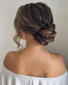 5 Quick and Gorgeous Bun Styles for Busy Mornings Low Bun With Tendrils, Soft Romantic Updo Low Buns, Twisted Low Bun Wedding Hair, Wedding Twist Hairstyles, Low Messy Updo Wedding, Romantic Low Bun Wedding, Messy Bun For Wedding, Loose Low Bun Wedding Hair, Bride Low Bun Hairstyles