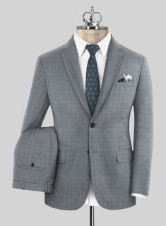 Stay on top of the latest fashion trends this season with our Bristol Artul Checks Suit. Made from pure wool fabric, the windowpane checked suit with a stylish blend of gray and blue shades that would add a touch of sophistication to your look and offers an elegant feel for a lasting impression in occasional attire.  Look Includes     Bristol Artul Checks  Fabric  Two Button Jacket Style  Notch Lapel   Horn Royal Black Buttons  Single Vent  Three Cuff Buttons  Two Welted Pockets on Trousers   Yo