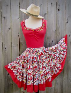 ADORABLE COLORFUL TWO PIECE SWIRL SKIRT AND TANK TOP! I Paired the Detailed Appliqued Roses/Leaves Red Stretch Knit Tank Top with a Vintage Ski Ads/Travel/Vanity Fair Novelty Themed Fabric, Tiered, Gathered Ruffle Skirt- aka 'Square Dance Skirt/ Rockabilly' Full of Personality! The True Red Top has Hand Sewn Multi Colored Rose Buds and Leaves with a Peek of Red Netting, Front and Back. So Pretty and Well Made! MEASUREMENTS: Skirt Waist- Elastic stretches from 29 inches as shown to 36 inches (skirt only)  Skirt Waist to Hem Length= 22.5 inches Wide Hip Area! HAT NOT INCLUDED Top Size: Bust 35 inches, as shown on model, but will stretch 2 or 3 inches all over due to the stretchy knit fabric. Armhole opening- 18.5 inches Label-Cordelia- Made in Indonesia- Size M Check Measurements Carefully Square Dance Blouses, Red Tiered Skirt For Dance, Square Dance Skirt, Spring Red Patchwork Skirt, Vintage Red Ruffled Skirt, Dance Skirt, Rose Leaves