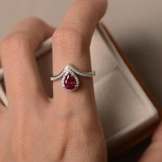 Lab ruby ring pear cut halo ring sterling silver red | Etsy Classic Ruby Ring With Pear-shaped Stone, Classic Pear-shaped Ruby Ring, Classic Pear-shaped Red Rings, Classic Red Pear-shaped Rings, Formal Teardrop Ruby Ring In Fine Jewelry Style, Teardrop Ruby Ring For Formal Occasions, Fine Jewelry Red Teardrop Ruby Ring, Formal Teardrop Ruby Ring Fine Jewelry, Red Ruby Pear-shaped Rings