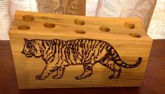 a wooden box with an image of a tiger on it