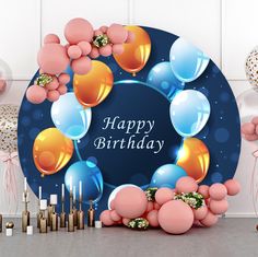 a happy birthday card with balloons and streamers in the shape of a circle on a blue background