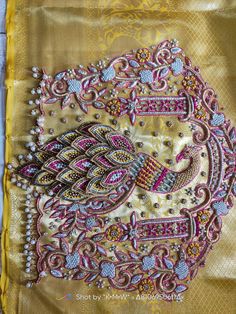 an intricately designed yellow and pink scarf