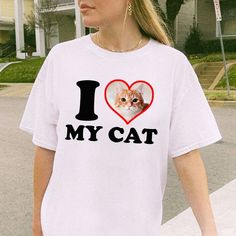 I Love My Cat Unisex Shirt, Baby Tee or Women Fitted Tee, Personalized Gift, Gift for Cat Mon, Cat Lover Gift, Pet Lover Gift DETAILS - 100% cotton (fiber content may vary for different colors) - tear-away label  SIZING Sizes vary by shirt style. Please check the size chart before making your purchase. PLEASE NOTE: Our Baby tee is sized for a youth, reminiscent of the '90s-era shrunken-down T-shirt. This style, popularized by the skater/raver culture of the time, is not to be confused with the m Funny White Top With Cat Design, Funny White Top With Cat Print, I Love My Cats, Chat Photo, 90s Era, 90s Baby, Baby T Shirts, Fitted Tee, Limassol