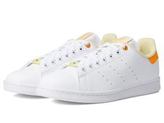 adidas Originals STAN SMITH HER VEGAN W - Women's Shoes : White/Almost Yellow/Orange Rush : Verified vegan construction. Keep your footwear fashion intent alive by adding adidas Originals STAN SMITH HER VEGAN W sneakers to your collection. Synthetic upper. Textile lining and insole. Round toe. Lace closure. Lift-back for added support. Padded collar. Perforated sides for breathability. Synthetic outsole. Imported. Measurements: Weight: 11 oz Product measurements were taken using size 8, width B Trendy Lace-up Adidas Sneakers, Trendy Adidas Sneakers For Streetwear, Footwear Fashion, Adidas Athletic Shoes, Womens Adidas, Shoes White, Lace Closure, Yellow Orange, Adidas Shoes