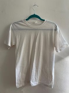 Vintage plain white threadbare t-shirt. Fair vintage condition. Size medium. Cheap White Ring-spun Cotton T-shirt, Summer 2025, White T Shirts, Plain White, White Tshirt, White Vintage, Favorite Outfit, United Kingdom, Gender Neutral