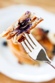 a piece of blueberry cheesecake on a fork