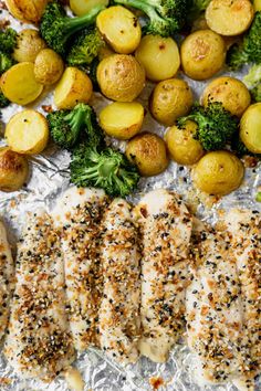 chicken, potatoes and broccoli on foil with seasoning sprinkles