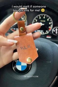 someone holding a keychain in their hand with the words, i would melt if someone bought this for me