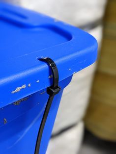 a blue table with a black cord attached to it