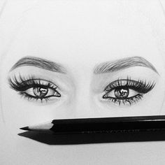 a pencil drawing of a woman's eyes and eyelashes