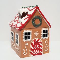 A Sweet Way To Store All Your Homemade Holiday Treats, This Cookie Jar Is Designed In The Likeness Of Gingerbread House. Crafted Of Glazed Ceramic For A Rustic Feel, It’s Painted By Hand And Adorned With Molded Details, Frosted Windows And A Candy-Cane Roof And Door, Bringing Holiday Cheer To Your Kitchen. Cookie Jar Is Crafted Of Glazed Stoneware. Hand Painted Finished In A Colored Glaze. Features A Decal On Backstump. Food Safe. Hand Wash. 8” W X 7” W X 9.25” H . Kids Gingerbread House, Homemade Holiday Treats, Kids Dining, Gingerbread House Cookies, Frosted Windows, Cookie Jars, Rustic Feel, Holiday Treats, Glazed Ceramic