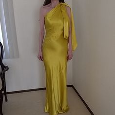 Stunning Evening Or Special Occasion Dress By Zara. It Is A Gorgeous Yellowish/ Gold Shade And Zips On The Side. The Dress Has A Beautiful Knotted Draping On The Left Side. This Dress Will Definitely Make Heads Turn. It Is New With Ticket. Yellow Maxi Evening Dress For Summer, Yellow Satin Party Dress, Yellow Sleeveless Maxi Dress For Formal Events, Yellow Sleeveless Maxi Dress For Formal Occasions, Sleeveless Yellow Maxi Dress For Formal Occasions, Chic Yellow Maxi Dress For Formal Occasions, Yellow Satin Midi Dress For Party, Yellow Formal Evening Dress For Summer, Fitted Yellow Satin Evening Dress