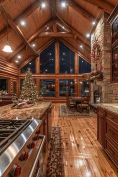 a large kitchen with wooden floors and vaulted ceiling