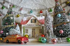 a christmas scene with a house and trees