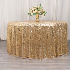 a gold table cloth with flowers on it