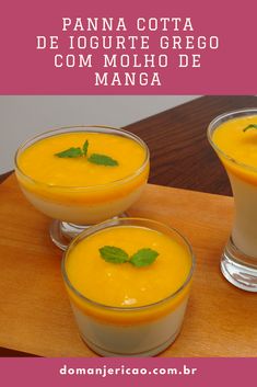 three glasses filled with food sitting on top of a wooden table