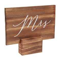 a wooden sign with the word mrs on it