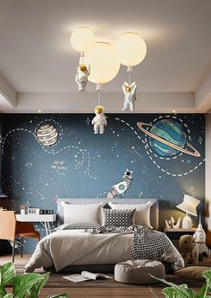 a bedroom with a space theme painted on the wall