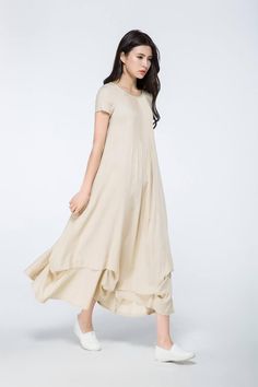 This linen dress is very ease to wear and beautiful. The long linen dress is suitable for any shaped lady. This is a really versatile but unique designer dress.this versatile designer dress can be worn both for daytime or to a party in the evening. Simply pair with the right accessories to dress it up or down depending on the occasion. FEATURES linen blend 50% linen,50% cotton No lining Scoop neckline Short sleeve No zipper A-line Loose fit Asymmetrical hem Perfect for summer,spring,autumn More Womens Linen Clothes, Beige Linen Dress, Plus Size Linen Dress, Plus Size Linen, Linen Dress Summer, Photo Sizes, Irregular Dress, Long Linen Dress, Summer Linen Dresses