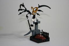 a lego figurine holding a knife and standing in front of a grave with an evil demon on it