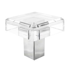 an acrylic square table with two legs and a glass cover on the top