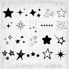 black and white stars are on a piece of paper that has been drawn with ink