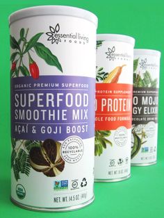 three cans of superfood smoothie mix on a green background