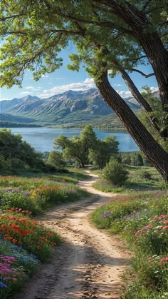 a dirt road with flowers and trees on both sides, leading to a large body of water