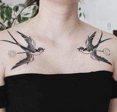 a woman with two birds on her chest