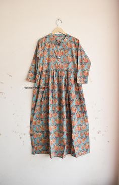 HarmomyHandicraftCo represent you a beautiful Hand Block Print cotton Long dress. Hand block print is a type of printing process which is done by using wood blocks and natural colors which means your are buying something which is handmade and a type of art which support artisans. *MEASUREMENT (APPROX) Size -  S Length - 56 Inches Chest - 36 Inches Shoulder - 15 Inches Sleeves length - 18 Inches Size -  M Length - 56 Inches Chest - 38 Inches Shoulder - 16 Inches Sleeves length - 18 Inches Size -  L Length - 56 Inches Chest - 40 Inches Shoulder - 16 Inches Sleeves length - 18 Inches Size -  XL Length - 56 Inches Chest - 42 Inches Shoulder - 16 Inches Sleeves length - 18 Inches Feel beautiful throughout your days wearing our cotton long dress. The material drapes beautifully, perfect for trav Designer Floor-length Block Print Dresses, Indian Style Dress, Cotton Block Print Semi-stitched Dresses, Bohemian Floor-length Block Print Dress, Festival V-neck Block Print Maxi Dress, Festival Block Print V-neck Maxi Dress, Block Print Dress, Cotton Maxi Dress, Cotton Long Dress