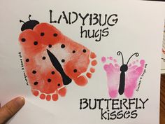 a lady bug and butterfly handprint on a piece of paper with the words ladybug hugs, butterfly kisses