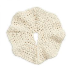 a white crocheted scarf on a white background with the corner cut in half