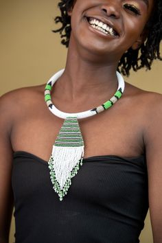 Unique African Maasai Handcrafted Beaded Necklace with an Elegant Look and Brilliant Finish. **GET FREE SHIPPING FOR ADDITIONAL ITEMS PURCHASED. Yes, Buy Multiple Items and pay shipping for 1 item only- The rest ships Free. (No Limits on the number of Multiple items). With a faster delivery time of 3 days via DHLExpress, Worldwide. Ordinary/Standard Shipping also available upon request. We Custom Make to Suit Your Taste. Available In All Colors and Sizes. For wholesale please chat me up for disc Artisan White Beaded Chain, White Artisan Beaded Necklaces With Beaded Chain, White Artisan Beaded Necklace With Beaded Chain, Artisan White Beaded Chain Necklace, Traditional Green Beaded Necklaces With Dangling Beads, Traditional White Beaded Necklaces For Festivals, Traditional Green Beaded Necklace With Dangling Beads, Traditional White Beaded Necklace With Dangling Beads, Artisan White Beads For Festival