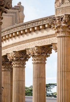 an arch in the middle of two stone pillars