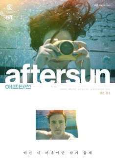 an advertisement for the film aftersun featuring a man underwater with a camera in his hand