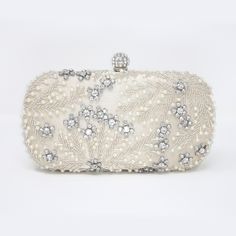 New to our Millennium collection, This beautiful romantic Beige crystal leaves embroidered and beads bridal clutch bag is made of very fine quality of crystal, beads rhinestones, fabric and metal and it comes with two chains, one chains length is 15 inches for a shoulder bad 46 inches long os cross body bag Detachable chain for your Big day! ► ABOUT YOUR ORDER * All items are neatly packaged in our beautiful jewelry boxes and elegant organza bags. * All items are 100% gift-ready. * Each order comes with a personalized handwritten card and a branded Millennium Bride jewelry cloth. * Each order comes with a free gift. ► PERSONALIZTION * If your order is a gift, you may contact us with the recipient's name or a message, and we'll print a personalized card that will be elegantly packaged with Elegant Embellished Bridal Accessories For Mother Of The Bride, Embellished Clutch Evening Bag For Reception, Glamorous White Clutch For Wedding, Glamorous Embroidered Evening Bag For Reception, White Embellished Evening Bag For Reception, Rectangular Hand Embellished Wedding Bag, Silver Evening Bag With Pearl Handle For Wedding, Wedding Bag With Pearl Handle In Silver, Silver Wedding Bag With Pearl Handle