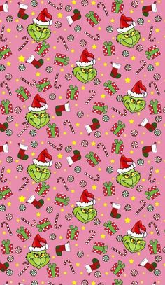 a pink background with green and red christmas themed items on the bottom right corner is an image of two grinos wearing santa's hats