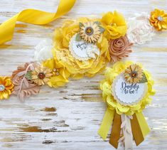 three yellow and white flowers on top of each other next to a ribbon with the words daddy love