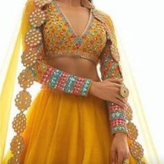 Mustard Lengha, With Intricate Details On The Sleeve And Bottom Of Lengha. Worn Once And Dry Cleaned And Ready For The Next Princess To Enjoy! *Can Be Fitted To Your Size, There’s Room Inside The Blouse To Get It Tightened* Elegant Yellow Choli For Navratri, Elegant Yellow Choli With Traditional Drape, Elegant Yellow Lehenga With Sheer Dupatta, Yellow Elegant Lehenga With Sheer Dupatta, Elegant Yellow Choli For Festivals, Yellow Sharara With Sheer Dupatta For Party, Elegant Yellow Festive Choli, Elegant Yellow Sharara For Festivals, Yellow Dori Work Party Sets