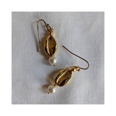 Dainty gold cowrie Shell and pearl Dangle earrings. Gold Pearl Drop Jewelry For Beach, Gold Pearl Shell-shaped Earrings, Summer Gold Pearl Drop Earrings, Gold Pearl Earrings As Summer Gift, Gold Drop Pearl Earrings For Summer, Gold Pearl Earrings For Summer Gifts, Gold Pearl Drop Earrings For Summer, Gold Pearl Earrings Perfect For Summer Gifts, Gold Pearl Drop Jewelry For Summer