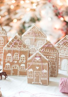 small gingerbread houses are sitting on a table